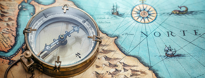 Conversion rates mark the spot A compass sitting on a map