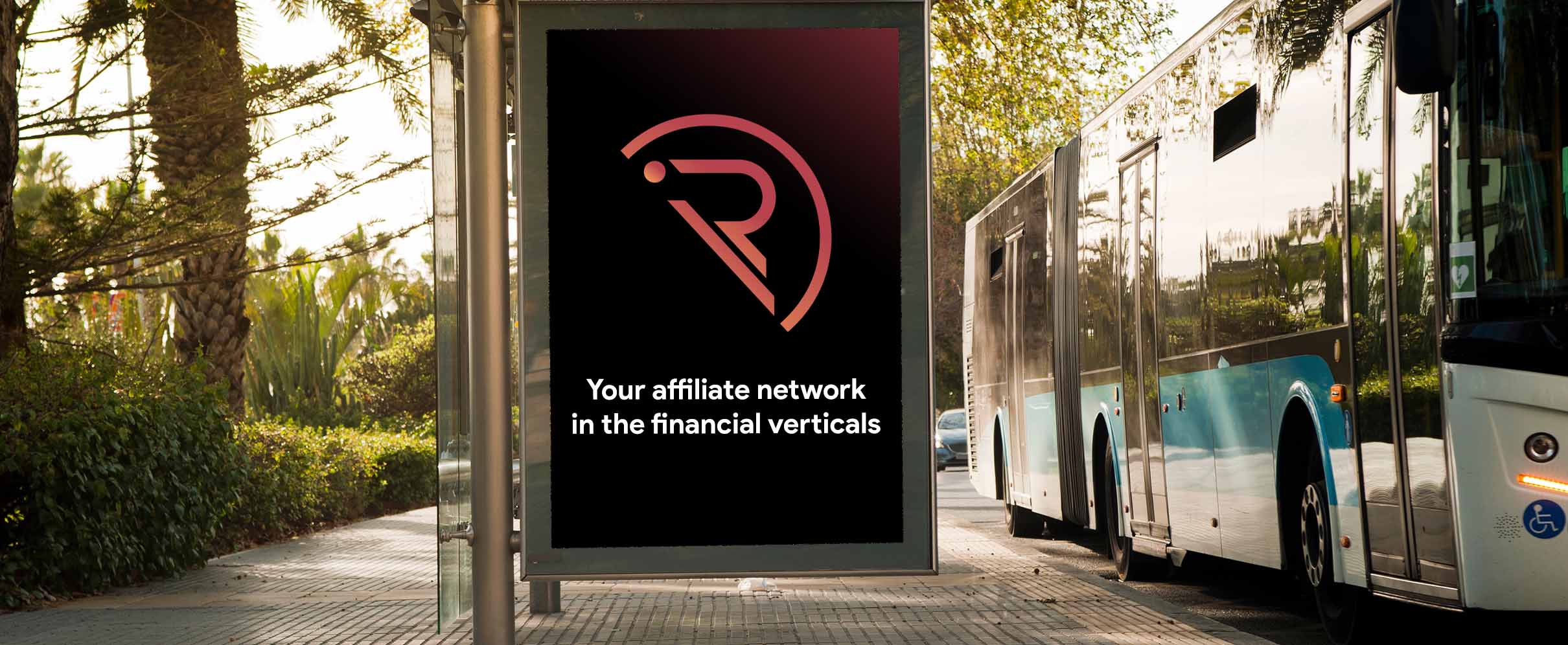 a bus stop that has a big sign that says 'Your affiliate network in the financial verticals'